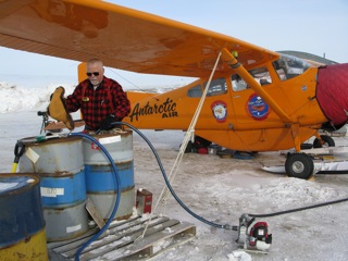 Refueling the Polar Pumpkin from drums, using my small Honda pump and system of hoses takes time.