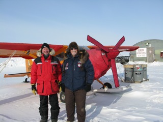 Dr. Dale Andersen and Art Mortvedt standing in front of the Polar Pumpkin at the Eureka Weather Station airport