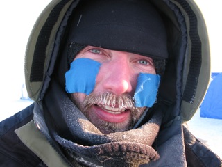 Audun Tholfsen with taped cheeks in preparation for the cold Arctic wind.