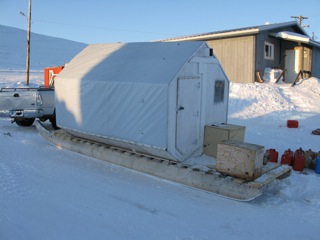 A home away from home camper cabin built on a snowmobile sled or komatik