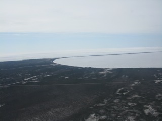 Looking south at the extreme northern end of Lake Winnipeg, one can only see water/ice on the horizon.