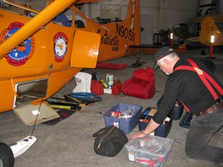 Art preparing gear in a Fairbanks hangar just prior to departure.�