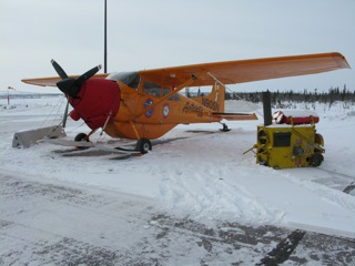 The Polar Pumpkin tied down for approaching bad weather at the Inuvik, Northwest Territories airport.
